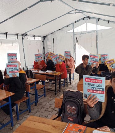 Children at a provisional school set up in a tent in Turkey